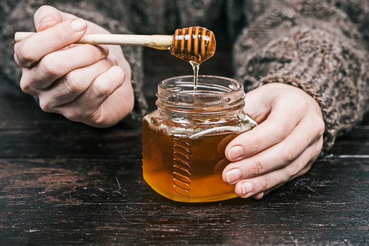 person eating honey