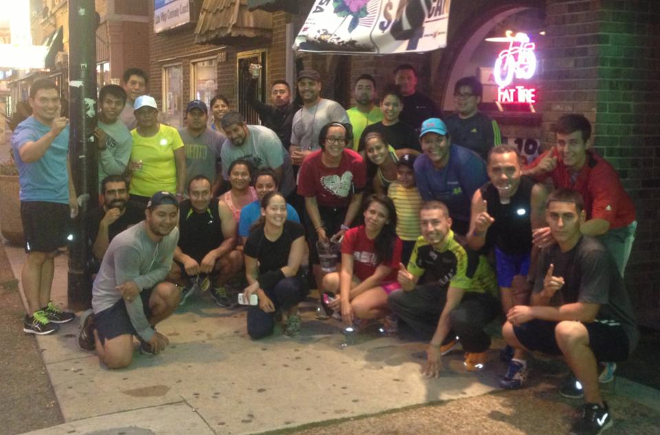 Members of Viento Running Group gather outside before a run