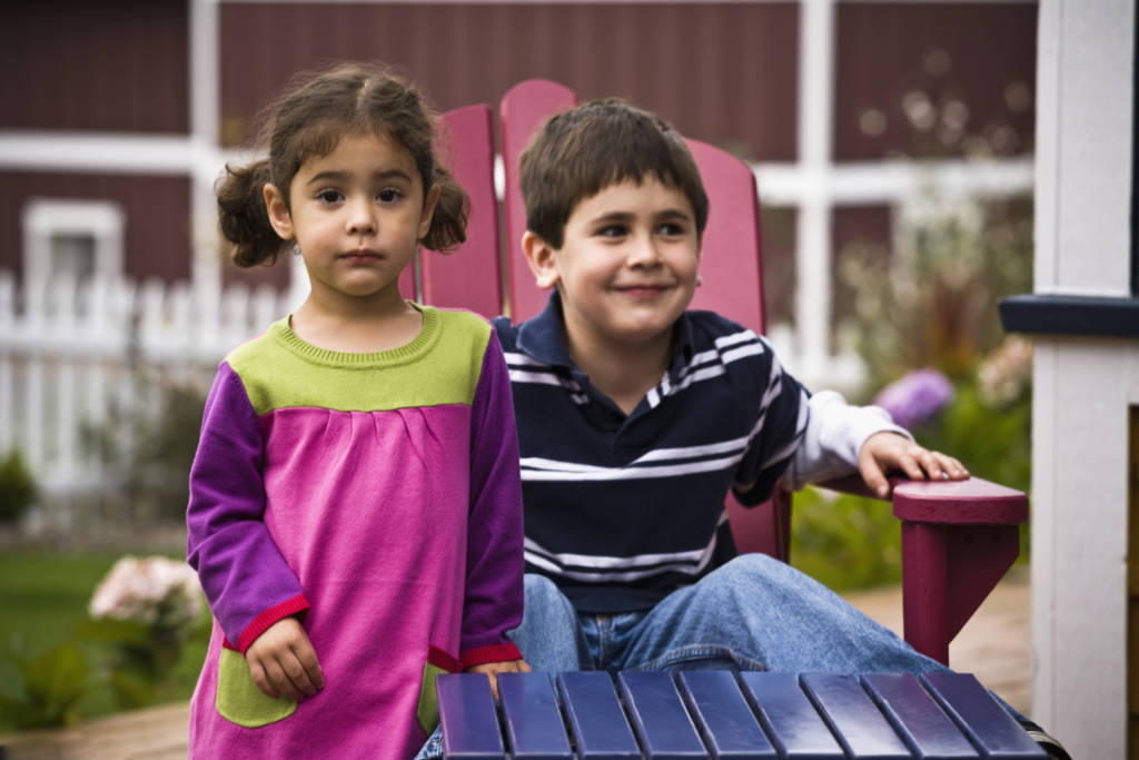 Brother and sister in backyard, boy and girl