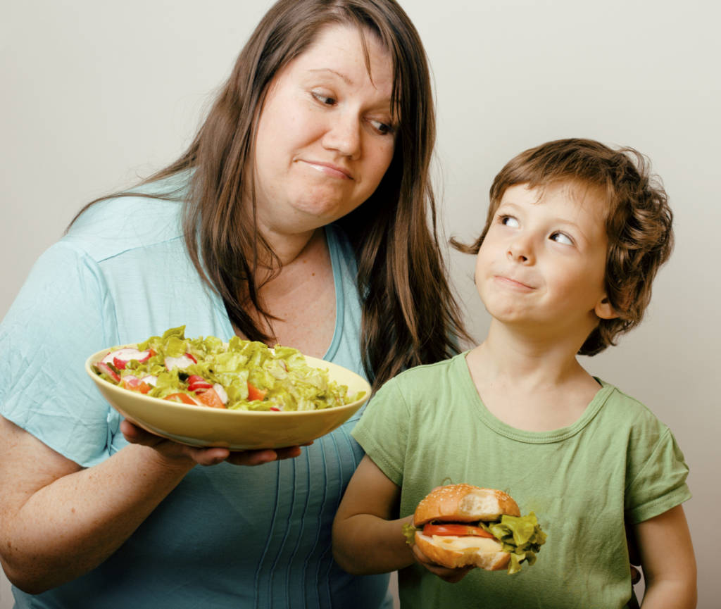 woman eating healthier with child
