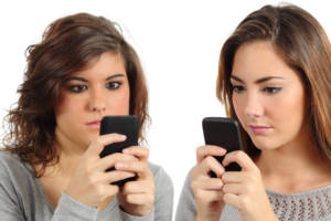Two teenagers addicted to the smart phone technology