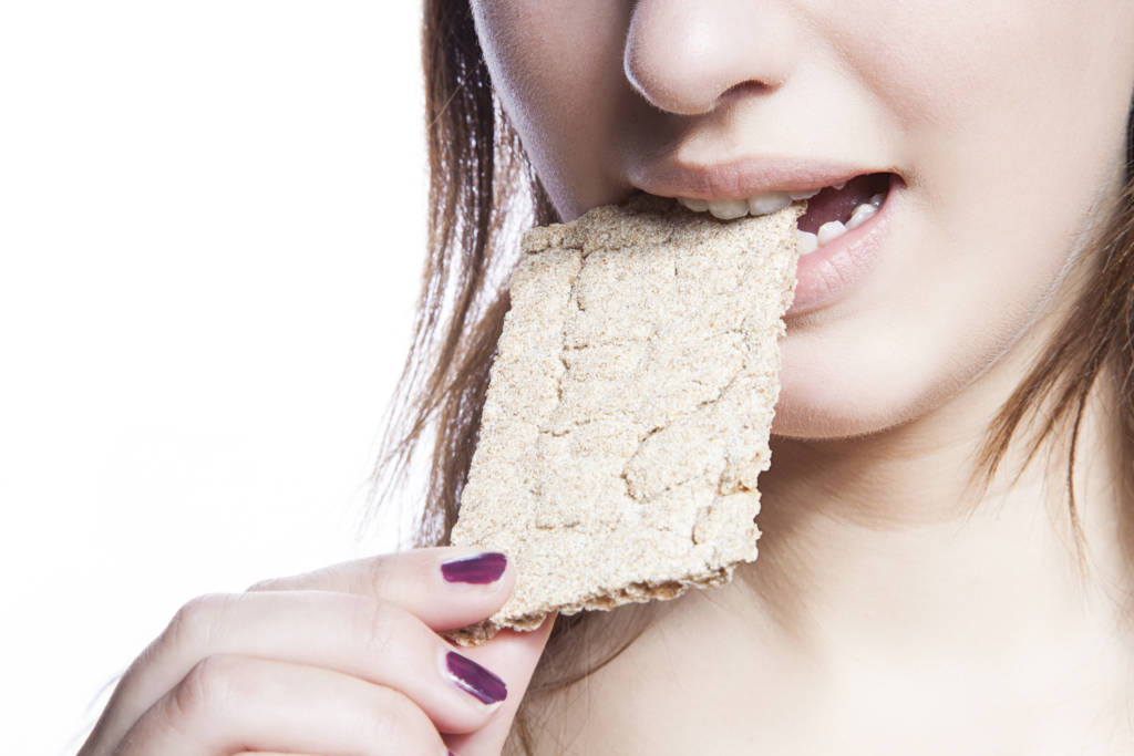 woman eating a cracker