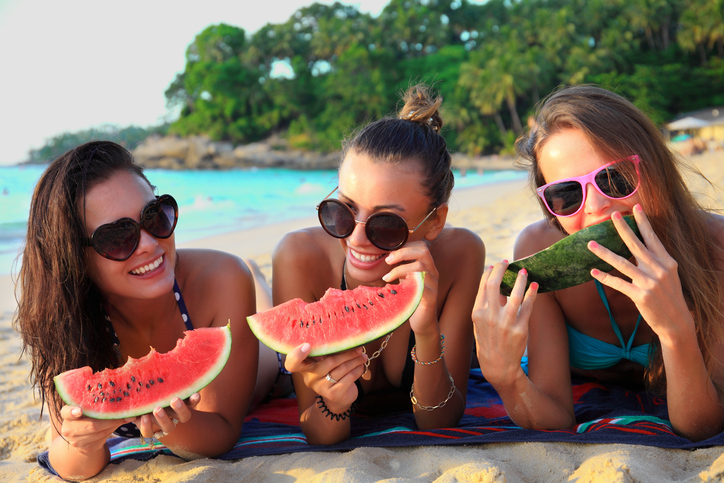 women eating watermelon
