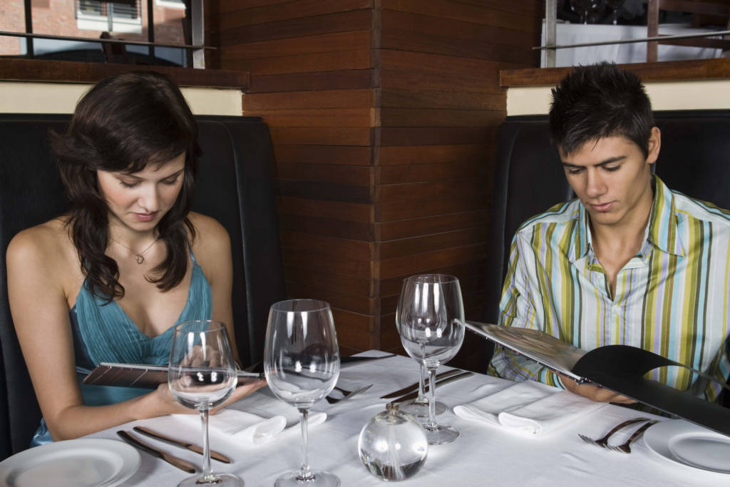 Couple looking at menu in restaurant