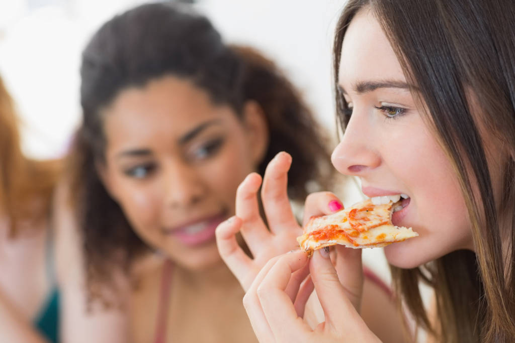 woman eating cheese pizza