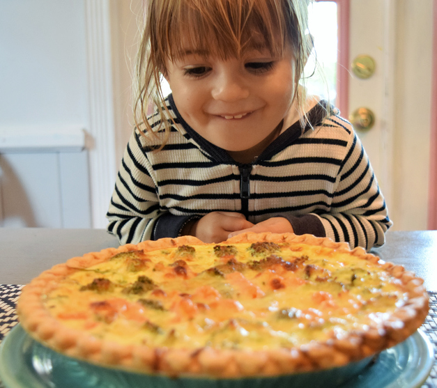girl eating pie, quiche